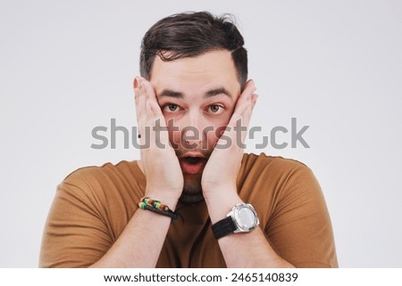 Surprise, announcement and portrait of man with news, info or drama on white background. Shocked, face and college student with crazy secret, gossip or emoji reaction to crisis at university
