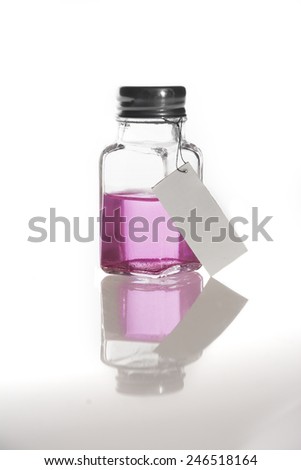 Pink liquid in a little bottle