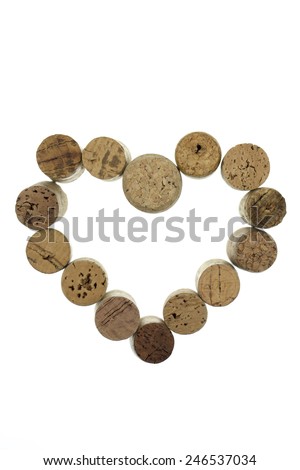 Wine corks form a heart shape image isolated on white background vertical
