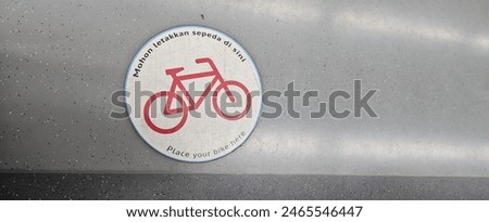 a sign to place a bike in the floor of a train