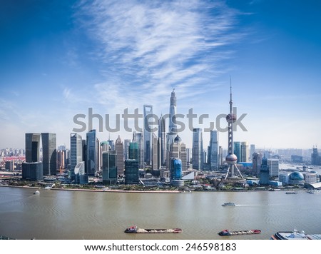 a bird's eye view of shanghai skyline with sunny sky
