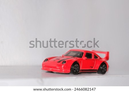 Red car toys with black tires 