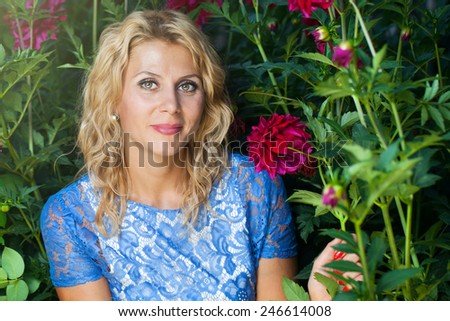 Beautiful girl in the flower garden