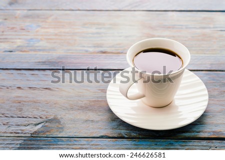Coffee cup on wooden tables - vintage effect style pictures