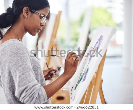 Woman, painter and easel canvas for art class or creativity workshop for learning, watercolor or small business. Female person, paintbrush and inspiration project or hobby process, relax or artistic