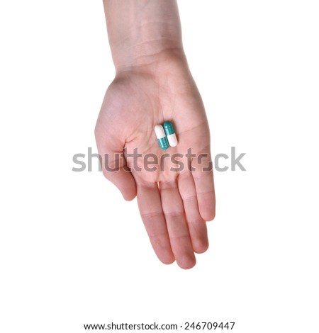 Isolated hand with two pills