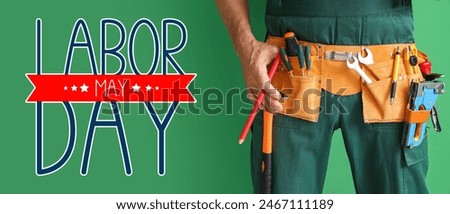 Greeting card for Labor Day with male worker and construction tools