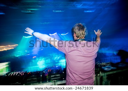 Dj at the concert, laser show and music