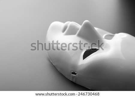 Theater mask on grey