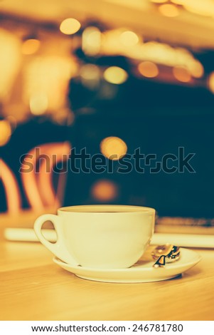 Coffee cup laptop in coffee shop - vintage effect style pictures