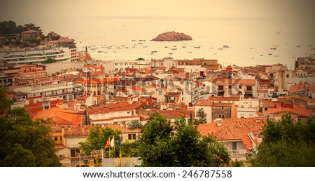 Tossa de Mar, Catalonia, Spain, JUNE 18, 2013: the panorama of the town from the top of the mountain on a cloudy day, instagram image style