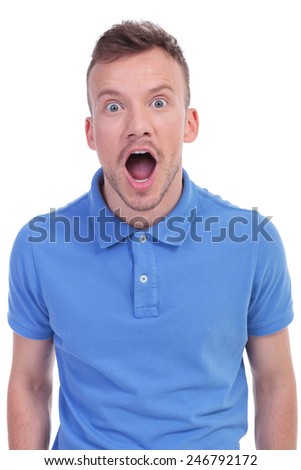 picture of a young casual man being amazed and left open mouthed. isolated on a white background