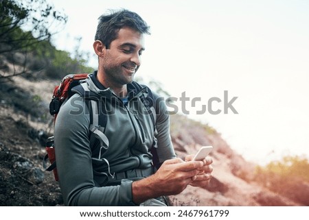 Phone, smile and hiking man in forest with backpack for fitness, training and location, search or path planning. Smartphone, chat or athlete in park with map, direction or sport app for step tracking
