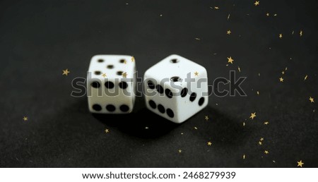 Image of stars falling over dices. Casino, gambling and digital interface concept digitally generated image.