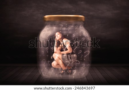 Businesswoman locked into a jar with question marks concept on background