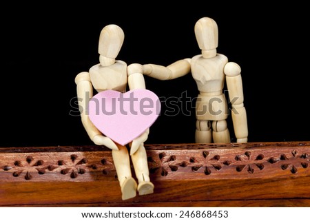 Wooden models with pink heart