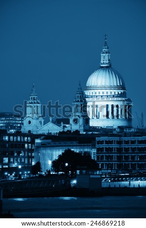 St Pauls Cathedral over Thames River at night in London in black and white.