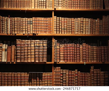 wooden bookshelf with antique books. Royalty-Free Stock Photo #246871717