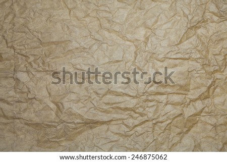 Textured brown paper background.