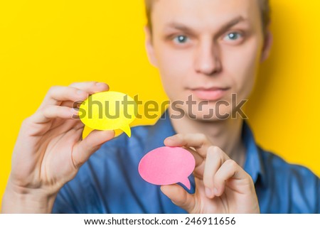 Manager holding comic speech balloon  