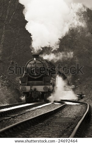 vintage steam train photographed in black and white with no identification markings visable