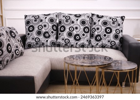 close-up photo of a corner sofa with a round pillow motif