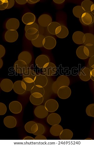 muted gold circles on a dark background