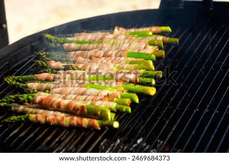 green asparagus wrapped in bacon, grilled