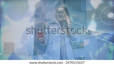 Image of network of connections with globe and data over biracial woman using smartphone. Global connections, networks and data processing concept digitally generated image.