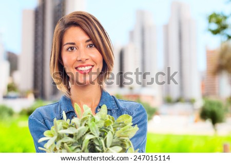 young cool woman with a plant