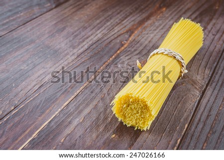 Pasta on wooden background - vintage effect style pictures
