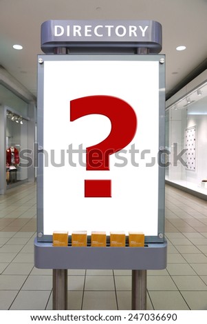 Question mark and direction sign inside shopping mall