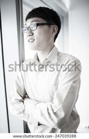 Portrait of a businessman looking at the window.Asian