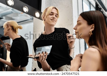 Long haired woman enjoying makeup session with stylist.
