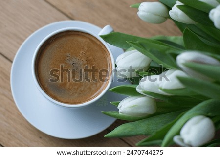 Coffee americano with white flowers