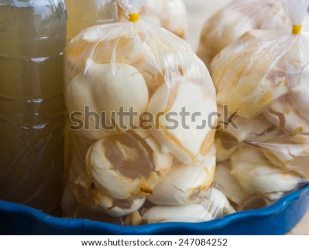 Plastic bags of Asian Palmyra palm, Toddy palm, Sugar palm slides on sale. The palm fruit is sweet and good drink