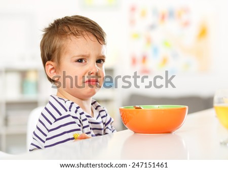 Little boy does not want to eat.  Royalty-Free Stock Photo #247151461