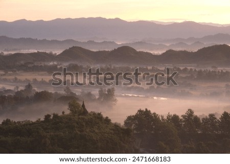 Evening view on top of the mountain at Rattanabun Chedi view point and gentle light In the valley there was a long mist. Located at Mrauk-U city, Myanmar.