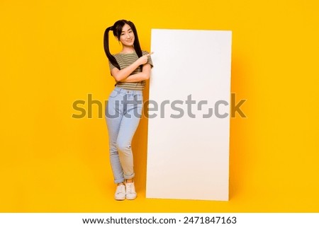 Full body photo of young girl promote recommend new smartphone app website isolated on yellow color background