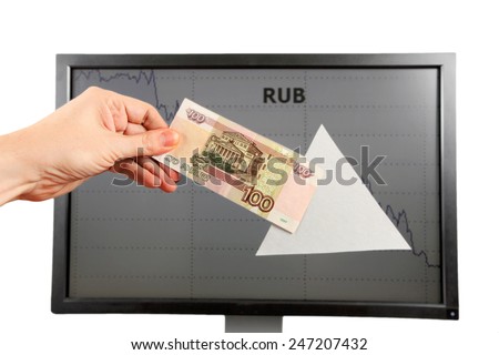 Big White Arrow in a Hand with Russian Ruble on the Monitor Background