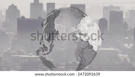 Image of spinning globe against aerial view of cityscape. Global networking and business technology concept