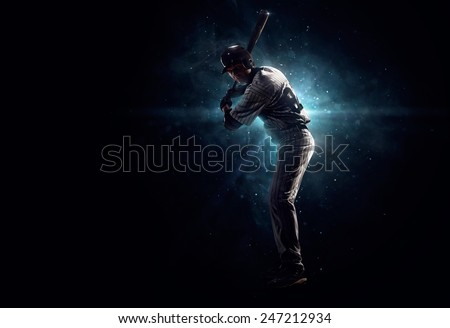 Professional baseball player  is tanding in the spotlight Royalty-Free Stock Photo #247212934