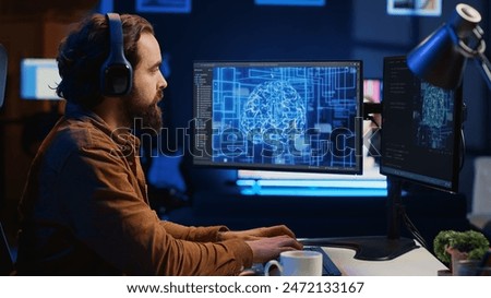 Developer updating artificial intelligence neural networks, drinking coffee and listening music in personal office. IT expert enjoying hot beverage and audio podcasts while writing AI code, camera A