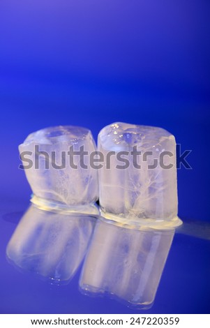 wet ice cubes on blue background