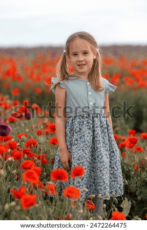 Girl in green dress is posing in the field. This photo has been taken in Czechia, 2024