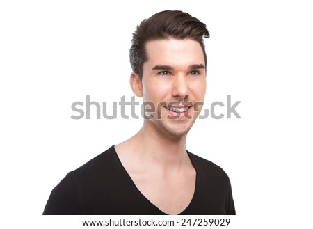 Close up portrait of an attractive young man smiling on isolated white background 