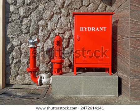 Red fire hydrant at an Indonesian gas station. Fire hydrants or water plugs provide the water firefighters need to extinguish fires. usually placed inside or outside buildings, parking areas.