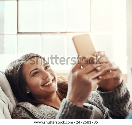 Phone, search and girl on a sofa with social media, streaming or reading subscription, sign up or service info at home. Smartphone, app and person in a living room with online dating, chat or scroll