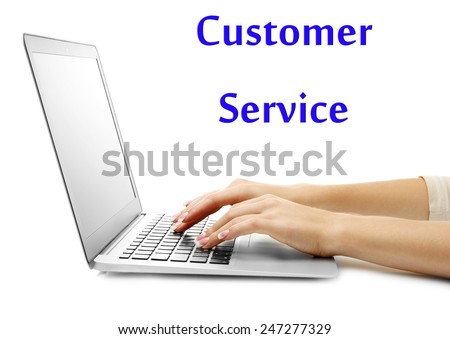 Female hands typing on laptop and Customer Service text isolated on white