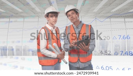 Image of diverse financial data and graphs over over caucasian male and female engineers. Architecture, engineering, economy and technology concept digitally generated image.